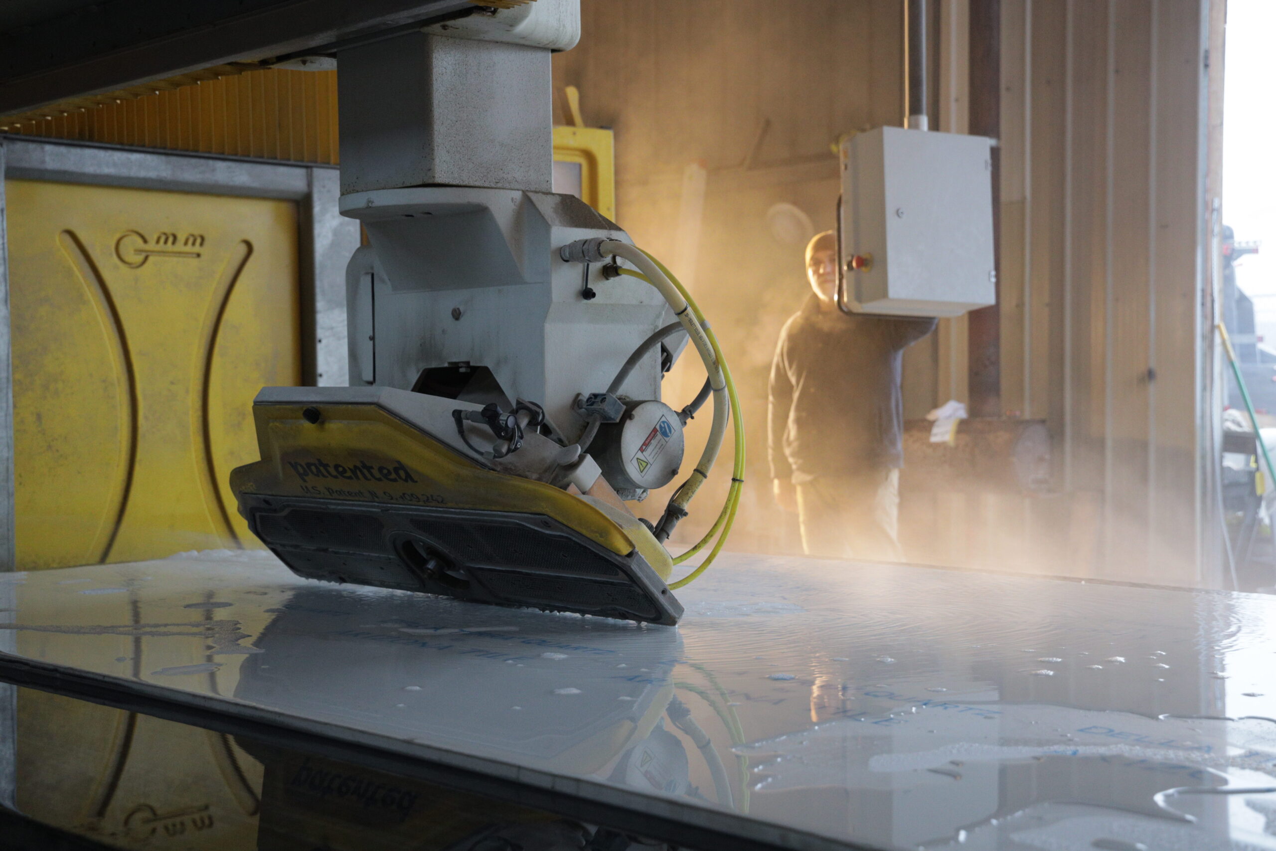 CNC stone fabrication machine cutting custom countertop