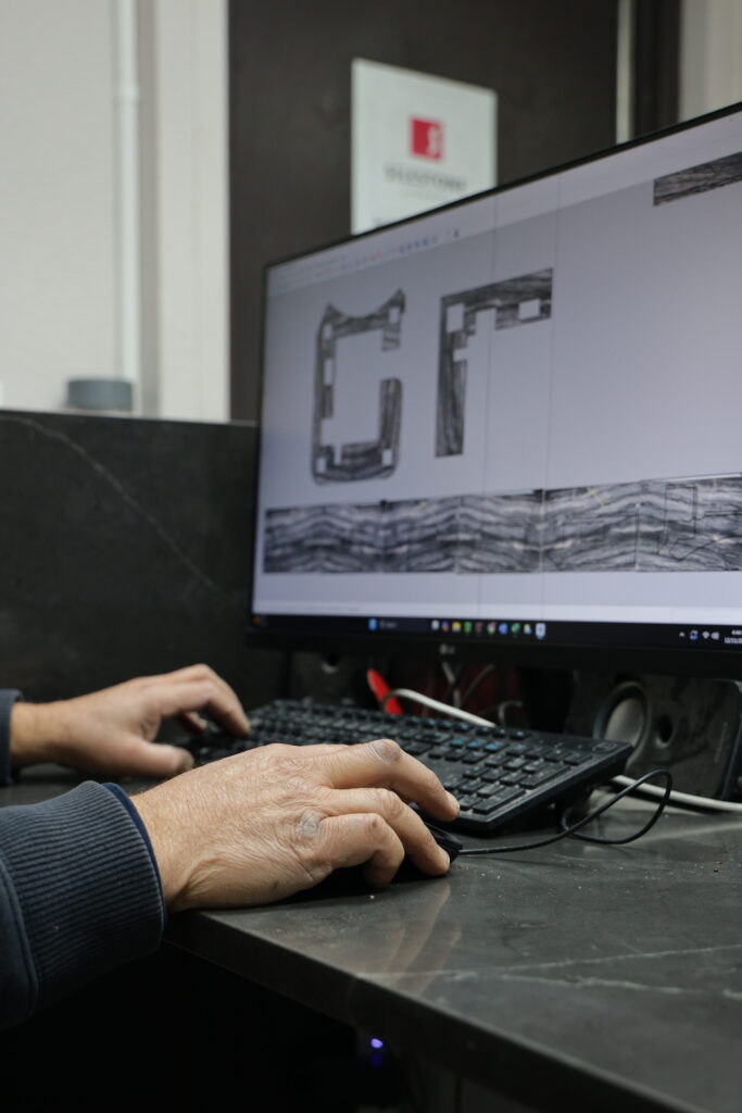 Stone Crafters team member creating visual countertop slab layout for vein matching