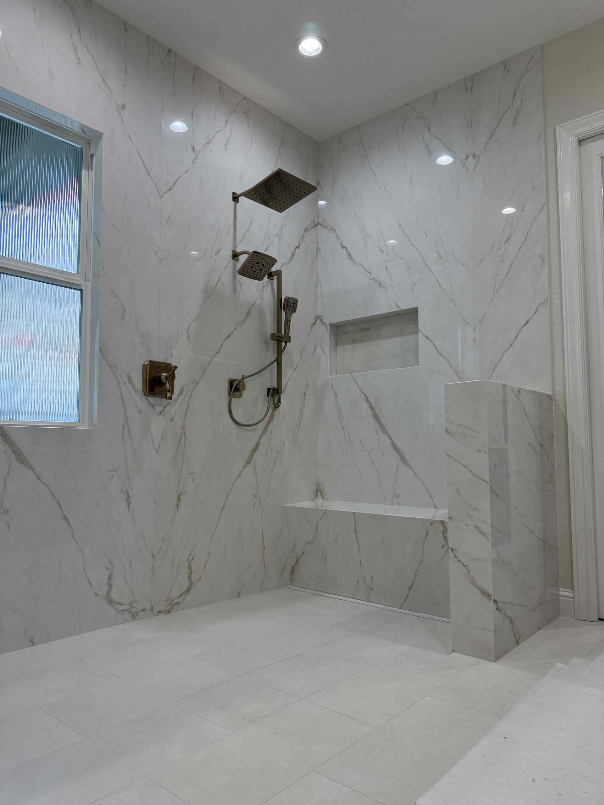 Professional slab shower installation by Stone Crafters crew